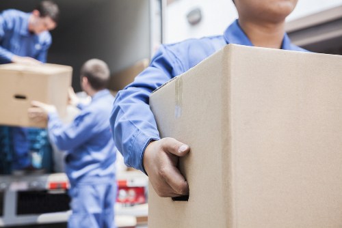 Professional movers handling household items in Walthamstow Village