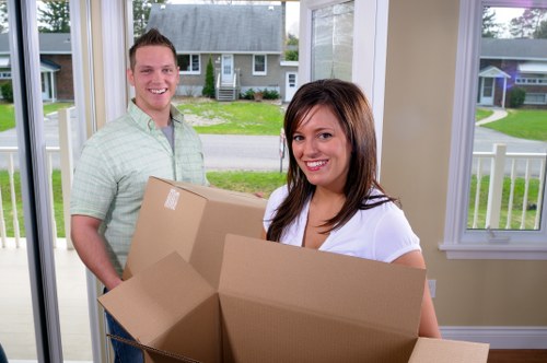 Experienced movers packing boxes securely