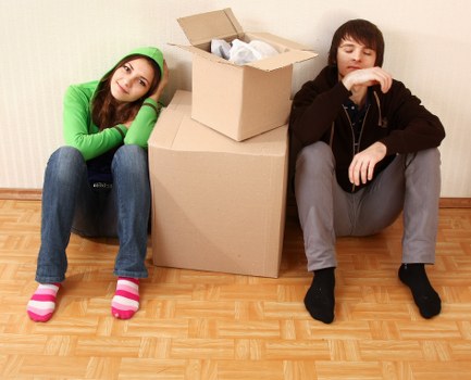 Professional movers handling boxes and furniture
