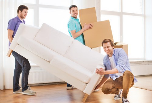 Packers securing items for safe relocation