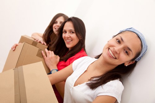 Professional movers handling furniture