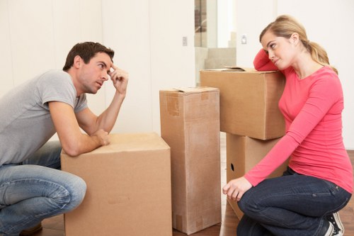 Friendly removal professionals assisting clients in De Beauvoir Town