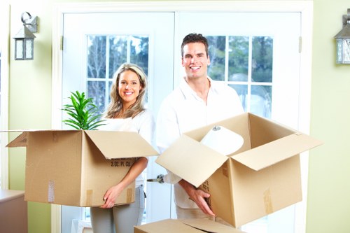 Professional movers handling furniture in Addiscombe