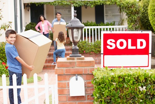 Movers handling furniture in Malden Rushett