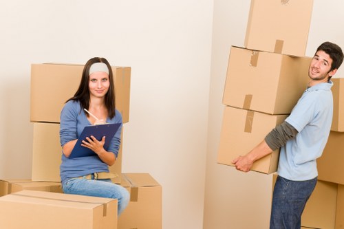 Experienced movers transporting a piano