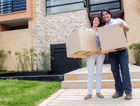 Movers organizing belongings in a new home